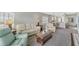 Bright and inviting living room with a view into the kitchen and bar seating at 8411 Placida Rd # 308, Placida, FL 33946