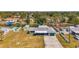 This aerial view of the property showcases the home with a pool, fenced yard, and convenient access to waterfront canals at 842 E 6Th St, Englewood, FL 34223