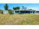 This house has a spacious backyard with a storage shed, offering great outdoor space and storage solutions at 842 E 6Th St, Englewood, FL 34223