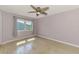 Cozy bedroom with wood-look floors and a view of the neighborhood at 842 E 6Th St, Englewood, FL 34223