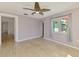 Bedroom featuring wood-look floors, neutral paint, and a door to another room at 842 E 6Th St, Englewood, FL 34223