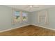 Inviting bedroom with wood floor and two large windows providing natural light and outdoor views at 842 E 6Th St, Englewood, FL 34223