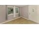 Entryway featuring wood-look floors, neutral paint, and a decorative front door at 842 E 6Th St, Englewood, FL 34223