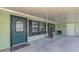 Inviting front porch with seating and tasteful details, creates a welcoming entrance to the residence at 842 E 6Th St, Englewood, FL 34223