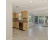 Open kitchen features stainless steel appliances, tile floors and a view to the outdoors at 842 E 6Th St, Englewood, FL 34223
