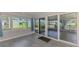 Inviting living room featuring large sliding glass doors that provide backyard views and lead to the patio at 842 E 6Th St, Englewood, FL 34223