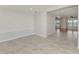 Open-concept living area featuring neutral paint, tile flooring, and ample space for entertaining guests at 842 E 6Th St, Englewood, FL 34223