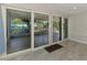 Bright room with large sliding glass doors leading to the outdoor patio for seamless indoor-outdoor living at 842 E 6Th St, Englewood, FL 34223