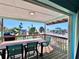 Outdoor deck with beach view, equipped with dining table and chairs at 8472 Grand Ave, Placida, FL 33946