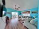 A sliding glass door leads to a large deck from the beautiful living room at 8472 Grand Ave, Placida, FL 33946