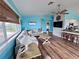 Spacious living room with hardwood flooring and nautical themed decor at 8472 Grand Ave, Placida, FL 33946