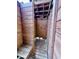 Rustic wood outdoor shower with hooks and built in bench at 8472 Grand Ave, Placida, FL 33946