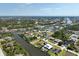Wide aerial shot displays waterfront homes, canals, and mature landscaping in the community at 9158 Melody Cir, Port Charlotte, FL 33981