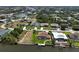 An elevated view capturing waterfront homes in a tranquil neighborhood, each with private docks and serene water views at 9158 Melody Cir, Port Charlotte, FL 33981
