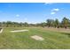 This beautiful backyard features a grassy area and a pond at 9158 Melody Cir, Port Charlotte, FL 33981