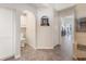 Lovely bathroom showcasing tile floors, an arched entry, and a seamless glass shower at 9158 Melody Cir, Port Charlotte, FL 33981