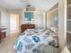 The lovely bedroom includes a bed, closet, and view of the hall at 9158 Melody Cir, Port Charlotte, FL 33981