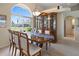 Elegant dining room features tile floors, lots of light, and a display cabinet at 9158 Melody Cir, Port Charlotte, FL 33981