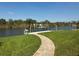 Charming waterfront property with private dock. Perfect for boating, fishing, and enjoying the tranquil water views at 9158 Melody Cir, Port Charlotte, FL 33981