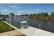 Waterfront property offering a private dock with a fish cleaning station at 9158 Melody Cir, Port Charlotte, FL 33981