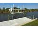 Enjoy waterfront living with a private dock featuring a boat lift for convenient access to the water at 9158 Melody Cir, Port Charlotte, FL 33981