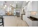 Spacious kitchen with stainless steel appliances, granite countertops, and abundant white cabinet storage at 9158 Melody Cir, Port Charlotte, FL 33981