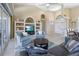 Cozy living area with modern furnishings, neutral color palette, and sliding glass door access at 9158 Melody Cir, Port Charlotte, FL 33981