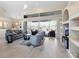 Spacious living room with modern furniture, vaulted ceilings, and sliding glass doors at 9158 Melody Cir, Port Charlotte, FL 33981