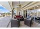 This covered patio has a beautiful view and a comfortable seating area at 9158 Melody Cir, Port Charlotte, FL 33981