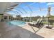 Enjoy this screened-in pool with a beautiful view of the canal at 9158 Melody Cir, Port Charlotte, FL 33981