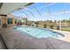 This immaculate screened-in pool offers a scenic view of the tranquil canal at 9158 Melody Cir, Port Charlotte, FL 33981