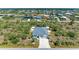 Aerial view of a home and community showcasing the property's location and curb appeal at 9283 Newnan Cir, Port Charlotte, FL 33981