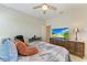 Bedroom with carpet, ceiling fan, closet, and a wooden dresser at 9283 Newnan Cir, Port Charlotte, FL 33981