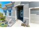 Charming entryway with decorative accents and a welcoming 'Welcome' flag at 9283 Newnan Cir, Port Charlotte, FL 33981