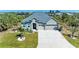 Charming single-Gathering home featuring a well-manicured lawn and a spacious two-car garage at 9283 Newnan Cir, Port Charlotte, FL 33981