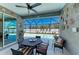 Screened lanai offering a dining table, seating, decor, and views of the pool at 9283 Newnan Cir, Port Charlotte, FL 33981