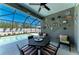 Screened lanai offers outdoor dining and lounging with clear views of the pool at 9283 Newnan Cir, Port Charlotte, FL 33981