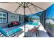 Well appointed, screened lanai featuring a pool, lounge seating, and outdoor entertaining at 9283 Newnan Cir, Port Charlotte, FL 33981