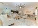 Open-concept living area features a comfortable seating arrangement and stylish décor at 9283 Newnan Cir, Port Charlotte, FL 33981