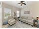 This living room features large windows, tile floors and modern decor at 9283 Newnan Cir, Port Charlotte, FL 33981