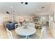 Open concept living area features large island, dining area and built in entertainment center at 9283 Newnan Cir, Port Charlotte, FL 33981