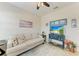 Cozy living room with neutral decor, light-filled, and comfortable seating arrangement at 9283 Newnan Cir, Port Charlotte, FL 33981