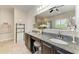 Main bathroom featuring double sinks, granite countertops, vanity, and a walk-in shower at 9283 Newnan Cir, Port Charlotte, FL 33981