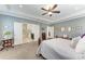 Main bedroom featuring neutral color scheme with doors to the en suite bath and walk in closet at 9283 Newnan Cir, Port Charlotte, FL 33981