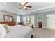 Main bedroom featuring neutral color scheme with a view of the en suite bath at 9283 Newnan Cir, Port Charlotte, FL 33981