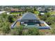 Aerial view showcases the screened-in pool and fenced yard at 9283 Newnan Cir, Port Charlotte, FL 33981