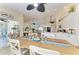 Open-concept dining room blending seamlessly with a modern kitchen and featuring stylish decor at 9404 Arnaz Cir, Port Charlotte, FL 33981