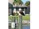 Majestic bald eagle perched on a piling in a waterfront community at 9404 Arnaz Cir, Port Charlotte, FL 33981
