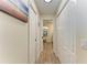 Hallway with linen closet leading to bathroom at 9404 Arnaz Cir, Port Charlotte, FL 33981