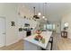 Beautiful kitchen with a large island, white cabinets and stainless steel appliances at 9404 Arnaz Cir, Port Charlotte, FL 33981
